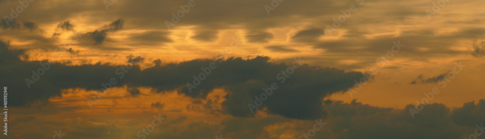 Golden skies panoramic pattern. Cloudy landscape. Nature background for design and decoration.