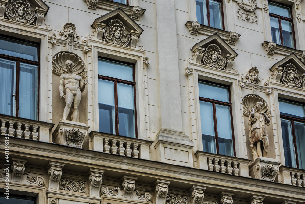 Architectural details of old picturesque dwelling house at Reichsrats street (Reichsratsstrasse) in the historic center of Vienna. Vienna, Austria.