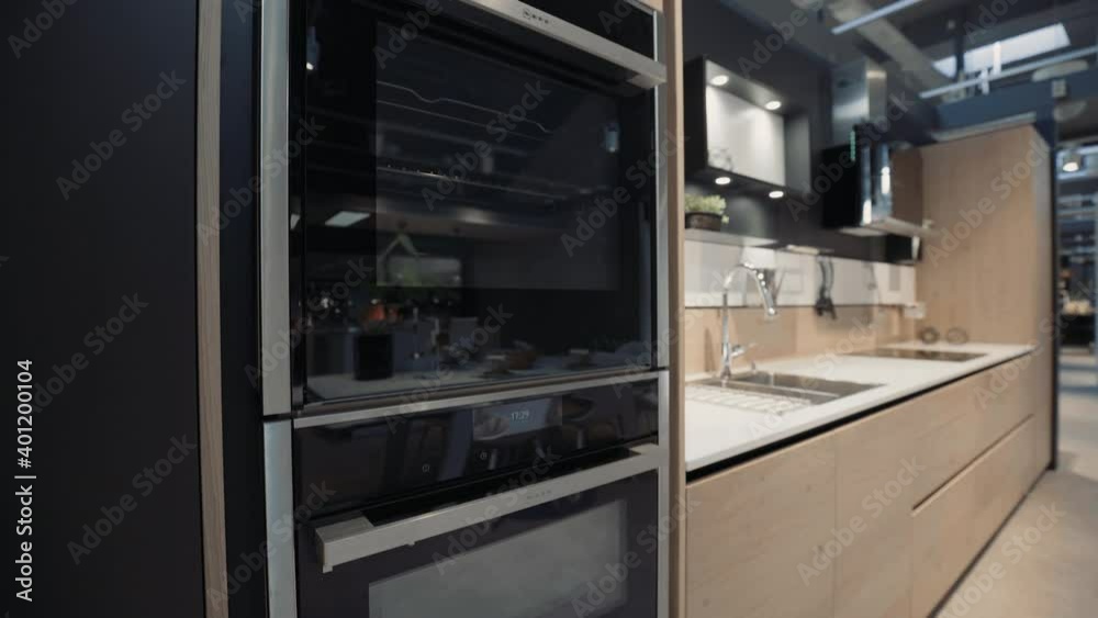 A wood kitchen showroom closeup gimbal shot