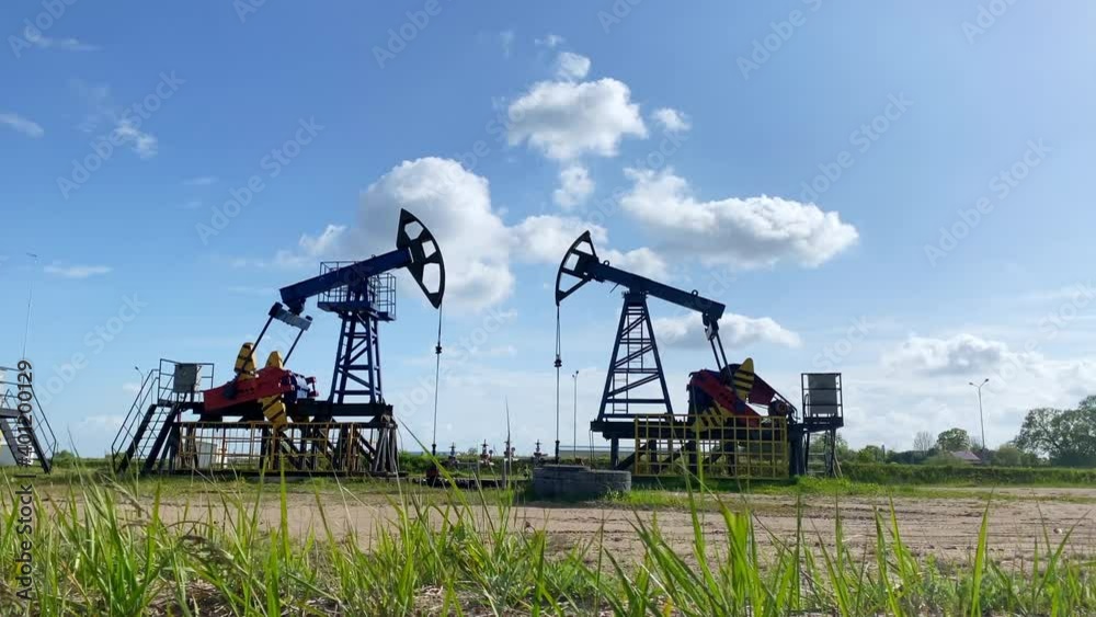 Working oil pumps from an oil field. Industrial equipment. Oil production. Silhouette. Working oil pumps from an oil field. Industrial equipment. Oil production. Silhouette.