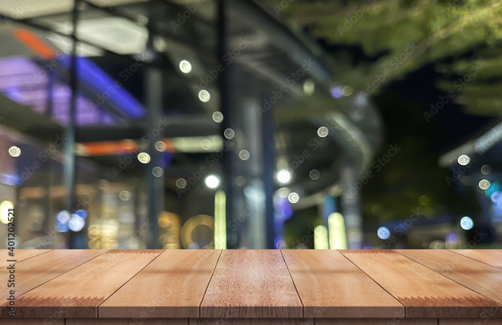 Wooden top table with bokeh light effect and blur restaurant on background, blur background. Wooden top table with bokeh light effect and blur restaurant on background, blur background.