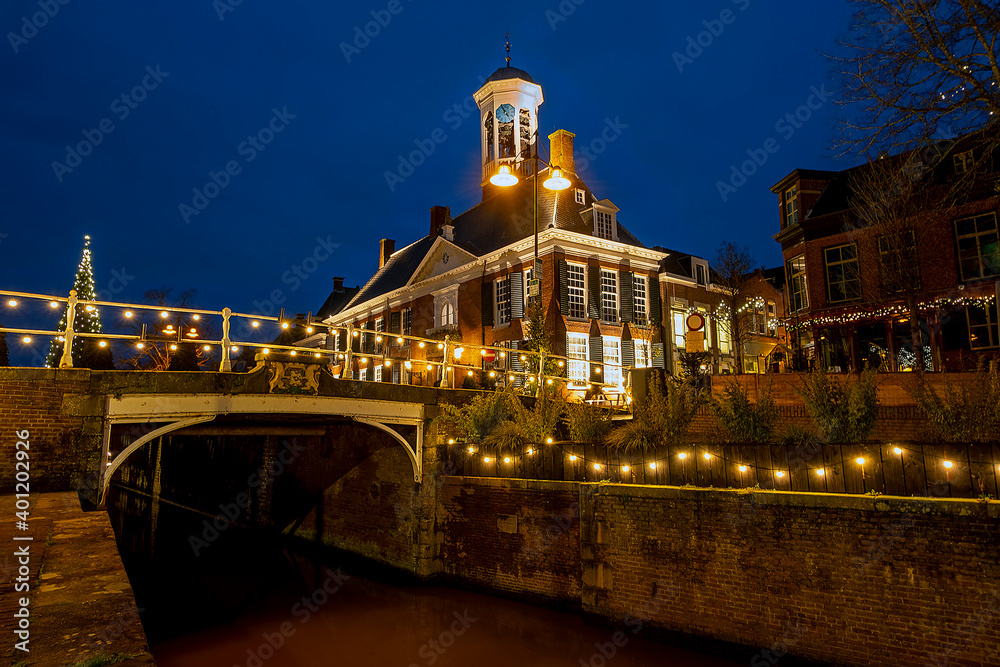 Medieval city hall from Dokkum in the Netherlands at twiligt in christmas time