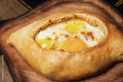 Georgian  Adjari khachapuri with cheese and egg yolk  photo