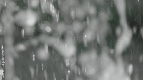 Blurred drops of blue water make up the motion background