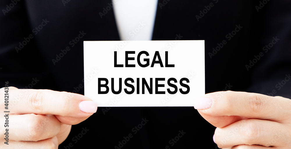 Biznemen holds a card with the text of Legal Business. Biznemen holds a card with the text of Legal Business.