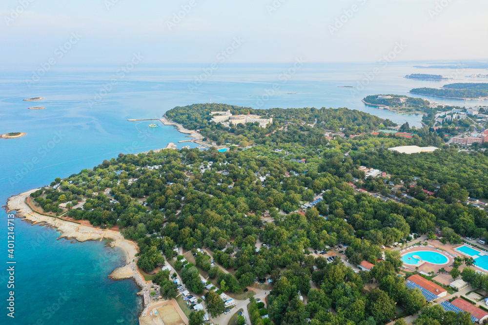 The winding coast of the Adriatic sea. There is a campsite on the beach. Shooting from the air.