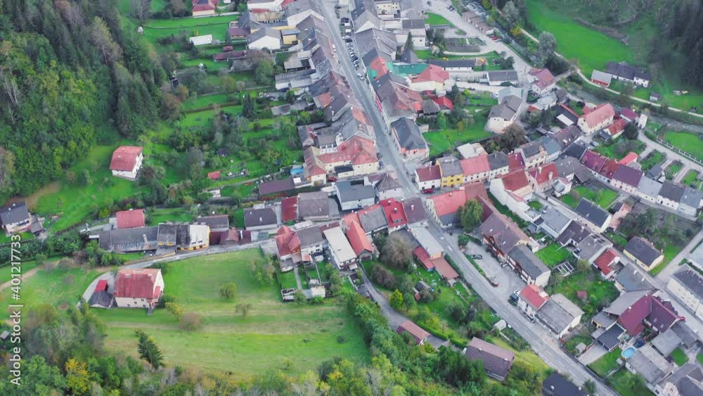 Aerial View Of Market Town In Eisenkappel-Vellach. Slow Pan Up Reveal Of Forest Mountains Aerial View Of Market Town In Eisenkappel-Vellach. Slow Pan Up Reveal Of Forest Mountains