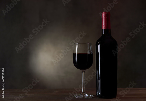 A Bottle Of Red Wine And Filled A Wine Glass
