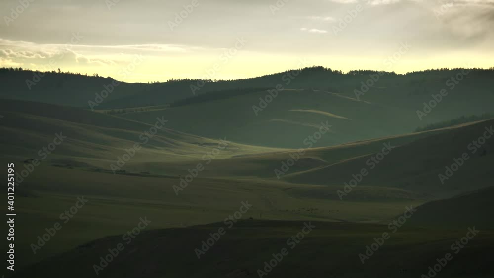 Shadow and local sunlight in the treeless hills. Continental climates often have a hot warm summers and cold winters. Alpine mountain climate is the higher topography regions. Mount mountainous 4K Shadow and local sunlight in the treeless hills. Continental climates often have a hot warm summers and cold winters. Alpine mountain climate is the higher topography regions. Mount mountainous 4K