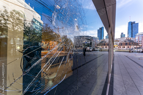 Frankfurt - November 2020 - a broken shop window in frankfurt city center symbolizing the latest riots in the city and querdenken demos due to mask obligation in the corona lockdown.