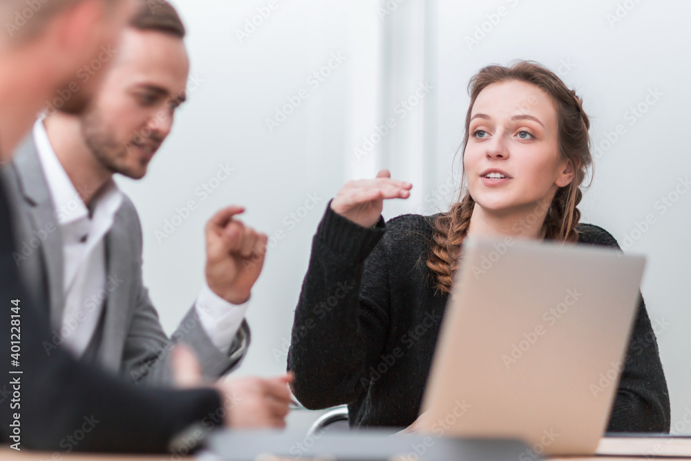 young businesswoman explaining her ideas to colleagues. young businesswoman explaining her ideas to colleagues.