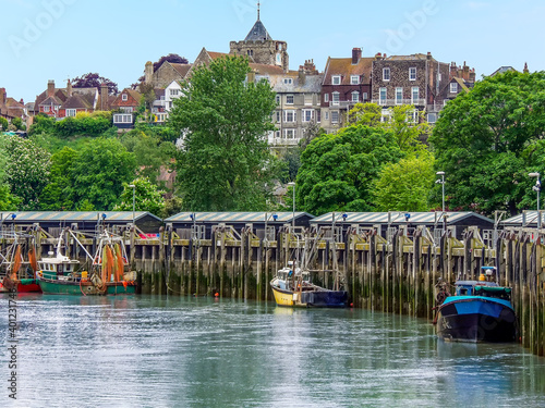 A view of boats moored on the River Rother in the town of  Rye, Sussex