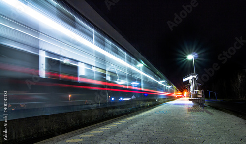 Departing train at night