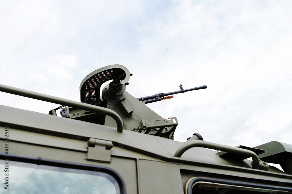 Machine gun on an armored personnel carrier. Military equipment of the infantry of the armed forces. Close-up. Copy space Machine gun on an armored personnel carrier. Military equipment of the infantry of the armed forces. Close-up. Copy space