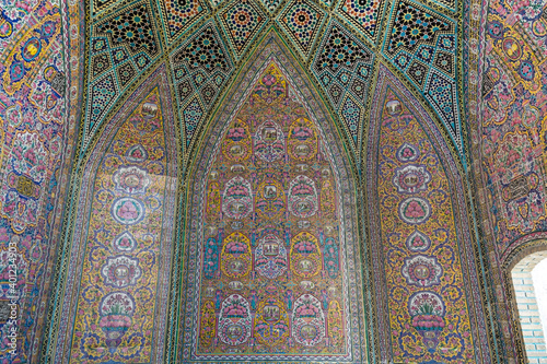 Colorful and rosy mosaic patterns on the ceiling of Nasir Al-Mulk Mosque (Pink Mosque) in Shiraz, Iran