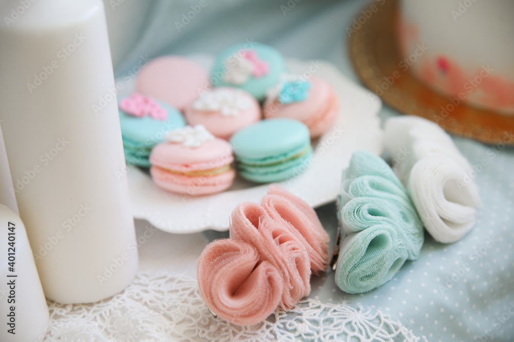 pink and turquoise macaroons and delicate jewelry made of chiffon. pink and turquoise macaroons and delicate jewelry made of chiffon.
