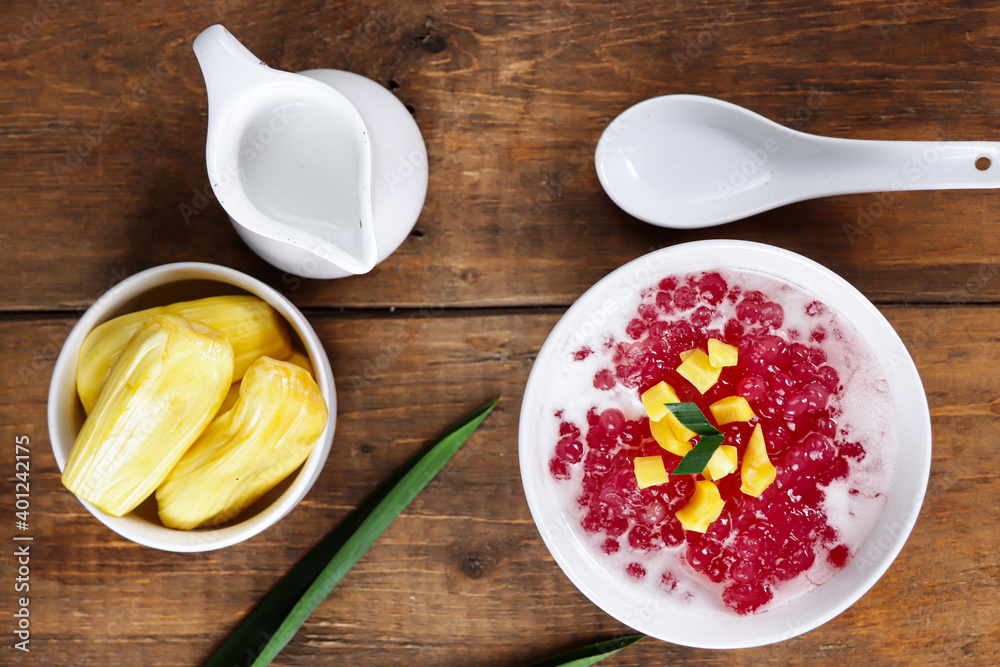 Indonesian dessert or sweet snack Bubur Sagu Mutiara. Made from pearl sago (sagu mutiara), sugar,Pandan leaves, and coconut milk, topping with jackfruit. Very famous during Ramadhan