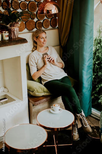 Pretty young woman sitting ...