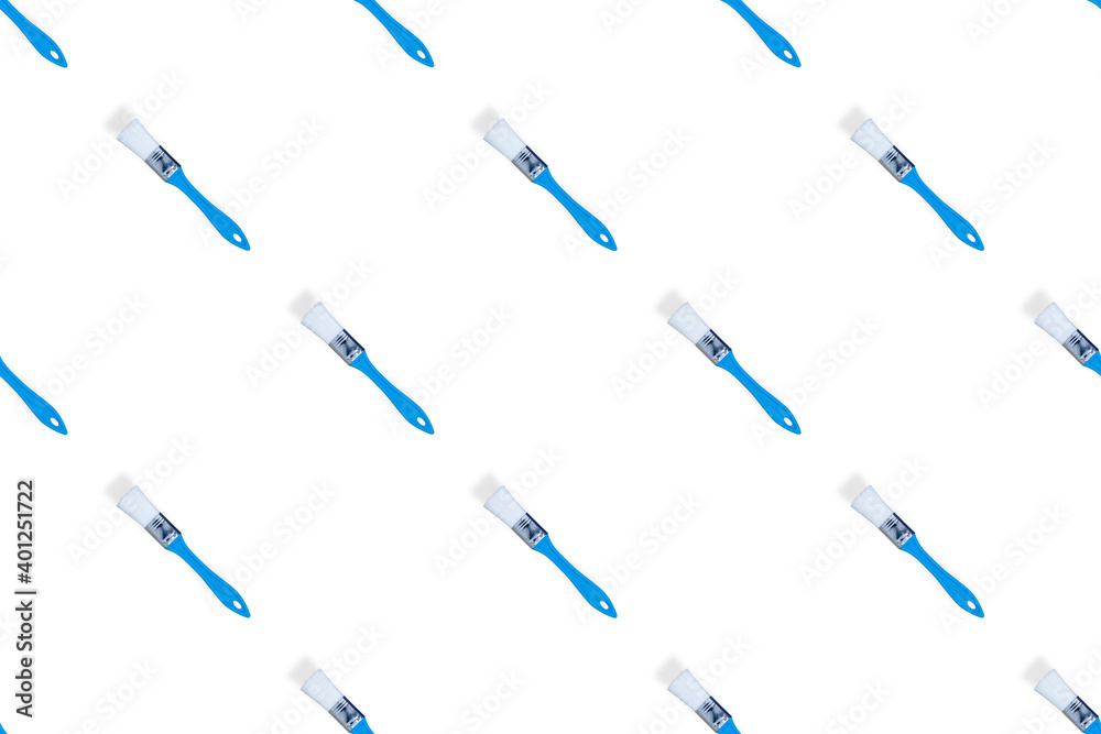 Construction brushes on a white background. Seamless texture from construction brushes.