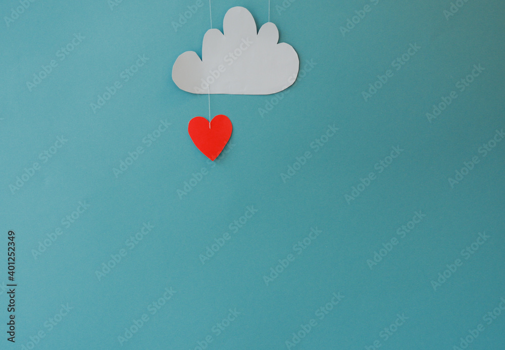 White paper hearts and clouds on a blue background. Abstract background with paper cut-out figures. Saint Valentine, mother's Day, birthday greeting cards, invitation, celebration concept