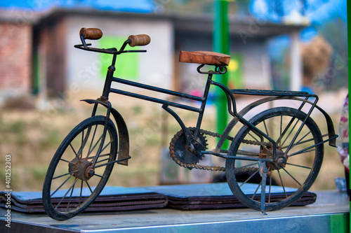 old bicycle in front of a wall