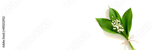 Header with bouquet of lily of the valley flowers. Gift for Mothers day on a white background. Spring concept.