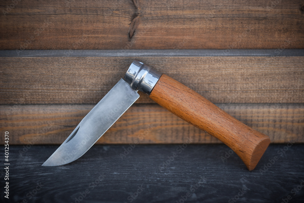 old knife on wooden table