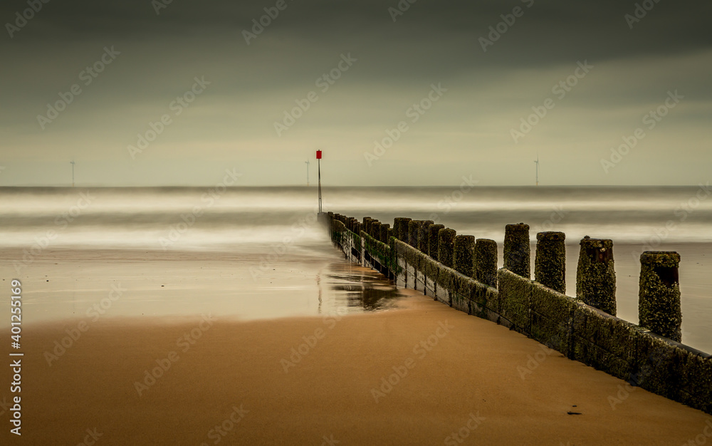 A stormy, cloudy and blustery day at Blyth beach in Northumberland, as the waves batter the coast