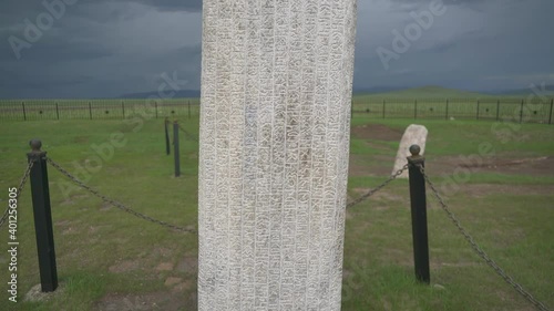 Historical runic alphabet inscription in Tonyukuk stone monument site.Ancient megalith megaliths carved with symbol symbols grave funerary commemorative kurgan stelae kurgans cemetery menhir standing  photo