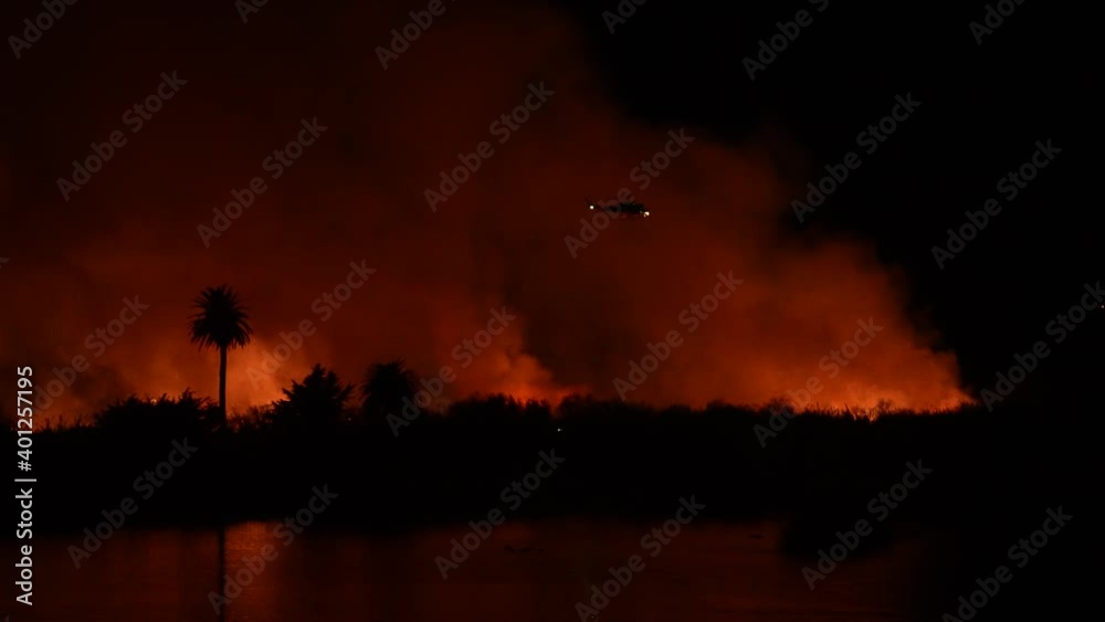 People watch massive fire burning at river bottom in Ventura, CA. People watch massive fire burning at river bottom in Ventura, CA. People watch massive fire burning at river bottom in Ventura, CA. People watch massive fire burning at river bottom in Ventura, CA.
