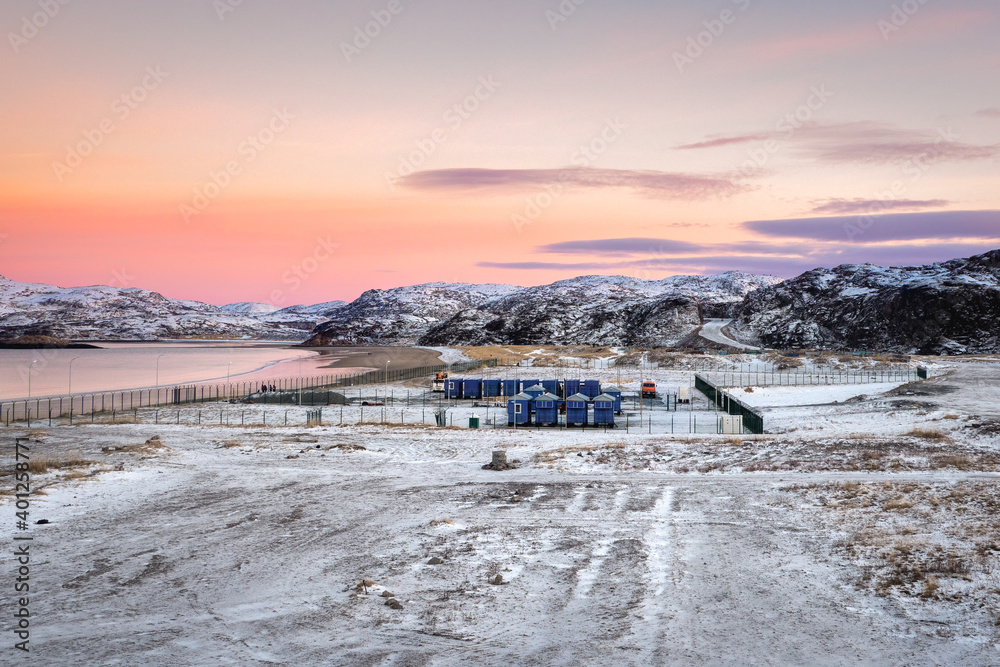 Shift camp in the Arctic, houses on the shore of the Barents sea.