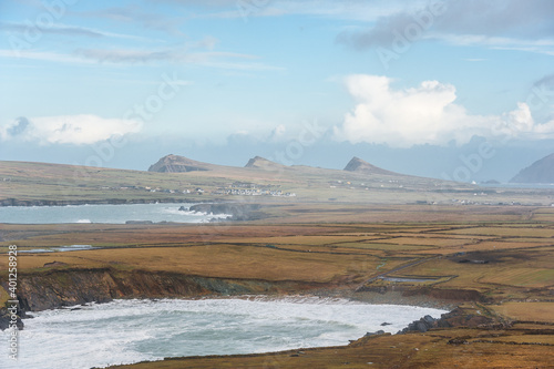 Scenic landscape with atlantic ocean shore, three mountains, hills and picturesque irish village during winter autumn season in Ireland. Concepts: season, outdoors, travelling, landscape