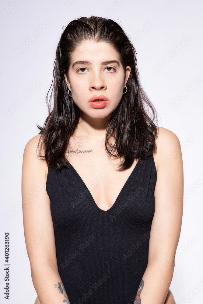 Dark hair caucasian girl on light blue Dark hair caucasian girl on light blue