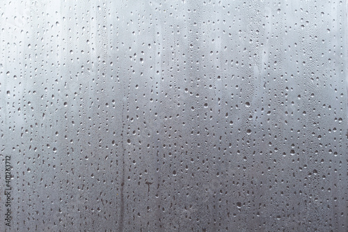 Water droplets on misted glass. Abstract background