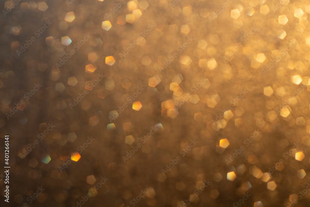 Blurred sunlight in water droplets on glass. Bokeh Blurred sunlight in water droplets on glass. Bokeh