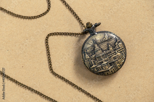 Vintage Antique pocket watch old fashion with brown background, Sensitive Focus