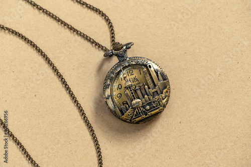 Vintage Antique pocket watch old fashion with brown background, Sensitive Focus