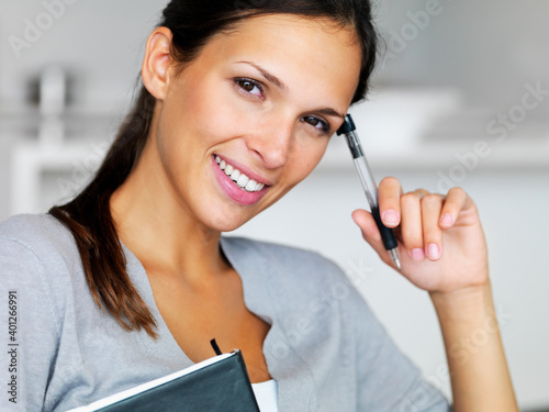 Woman writing in notebook
