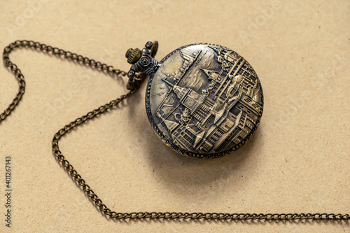 Vintage Antique pocket watch old fashion with brown background, Sensitive Focus