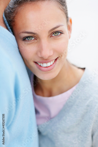 Woman leaning on man`s chest photo