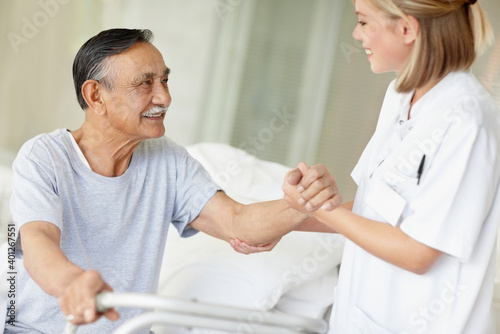 Wallpaper Mural Nurse assisting patient with a walker Torontodigital.ca