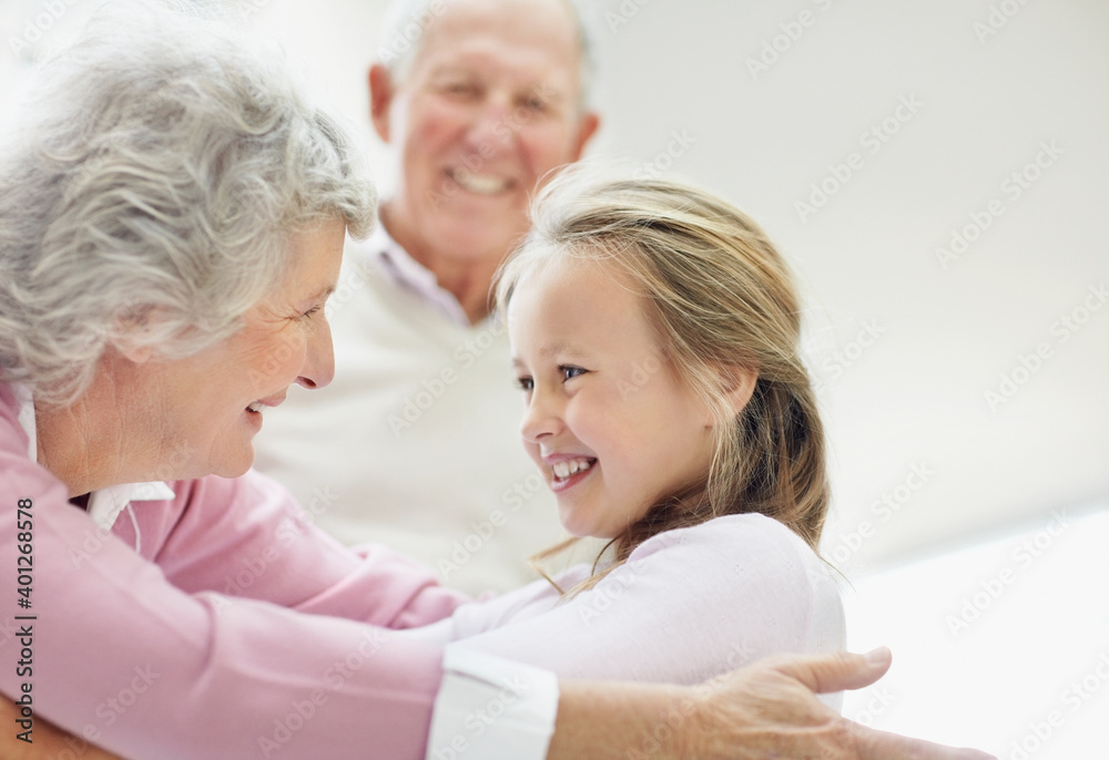 Granddaughter hugging her grandmother Granddaughter hugging her grandmother