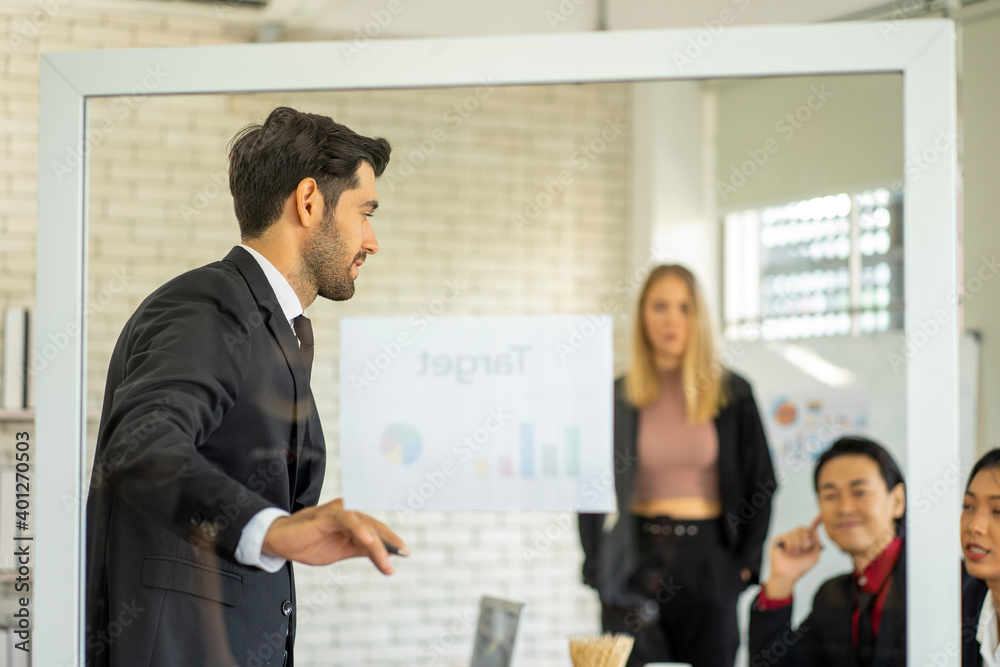 Caucasian and mixed race business man and woman wearing formal suit in the office Caucasian and mixed race business man and woman wearing formal suit in the office