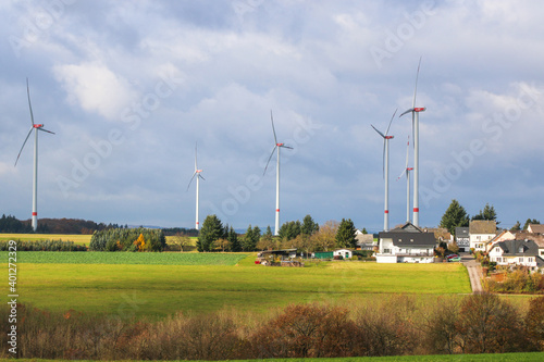 Renewable energies, power generation with wind turbines in a wind farm, selective focus, nobody, no people.
