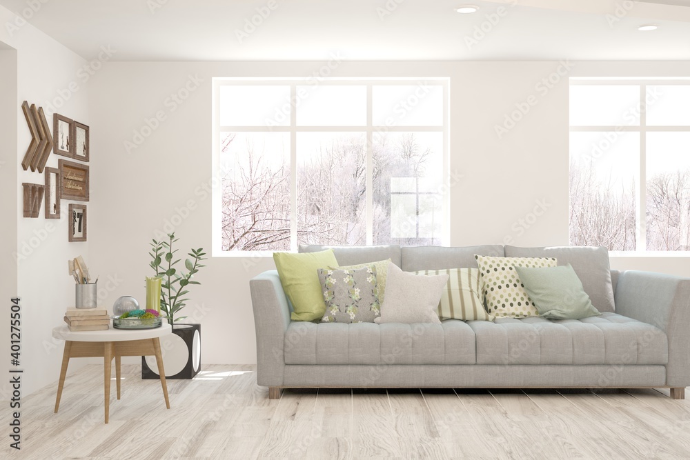 Fototapeta premium White living room with sofa and winter landscape in window. Scandinavian interior design. 3D illustration