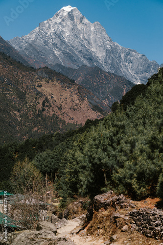 Majestic scenery of desert rough rocky mountainous terrain under blue sky in sunny day