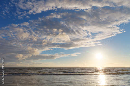 Sun Shining Bright In The Blue Skies Over The Sea