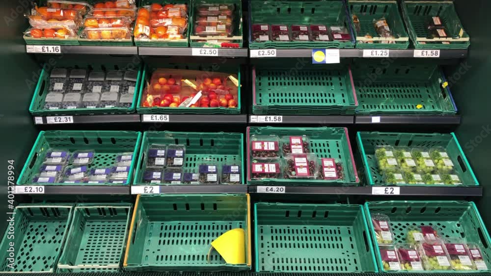 London UK, December 23rd 2020: Tesco fruit and vegetable baskets on shelves. Signs of low supplies to re-stock, cost of living, inflation. Concept for food shortages.