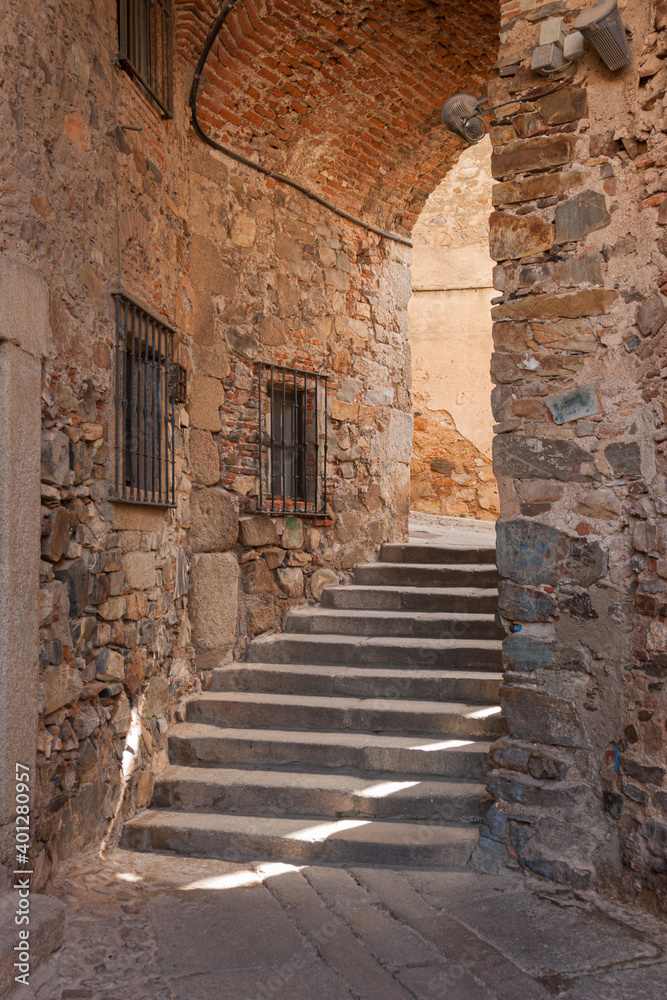 Medieval passageway with stairs in the ancient city of Caceres in Spain. Medieval passageway with stairs in the ancient city of Caceres in Spain.