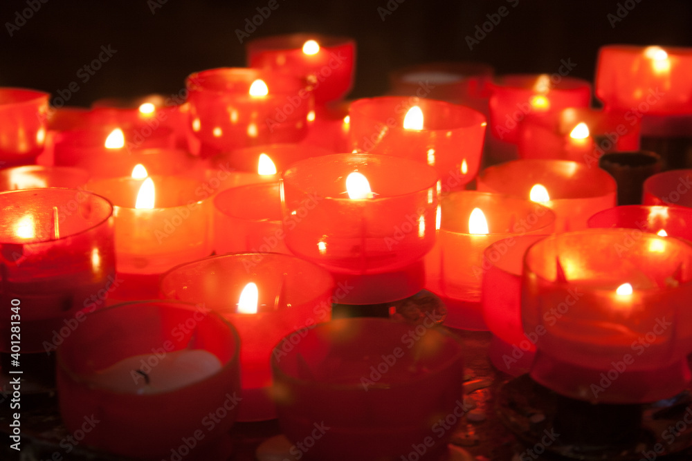 Group of red burning candles on black background. Group of red burning candles on black background.